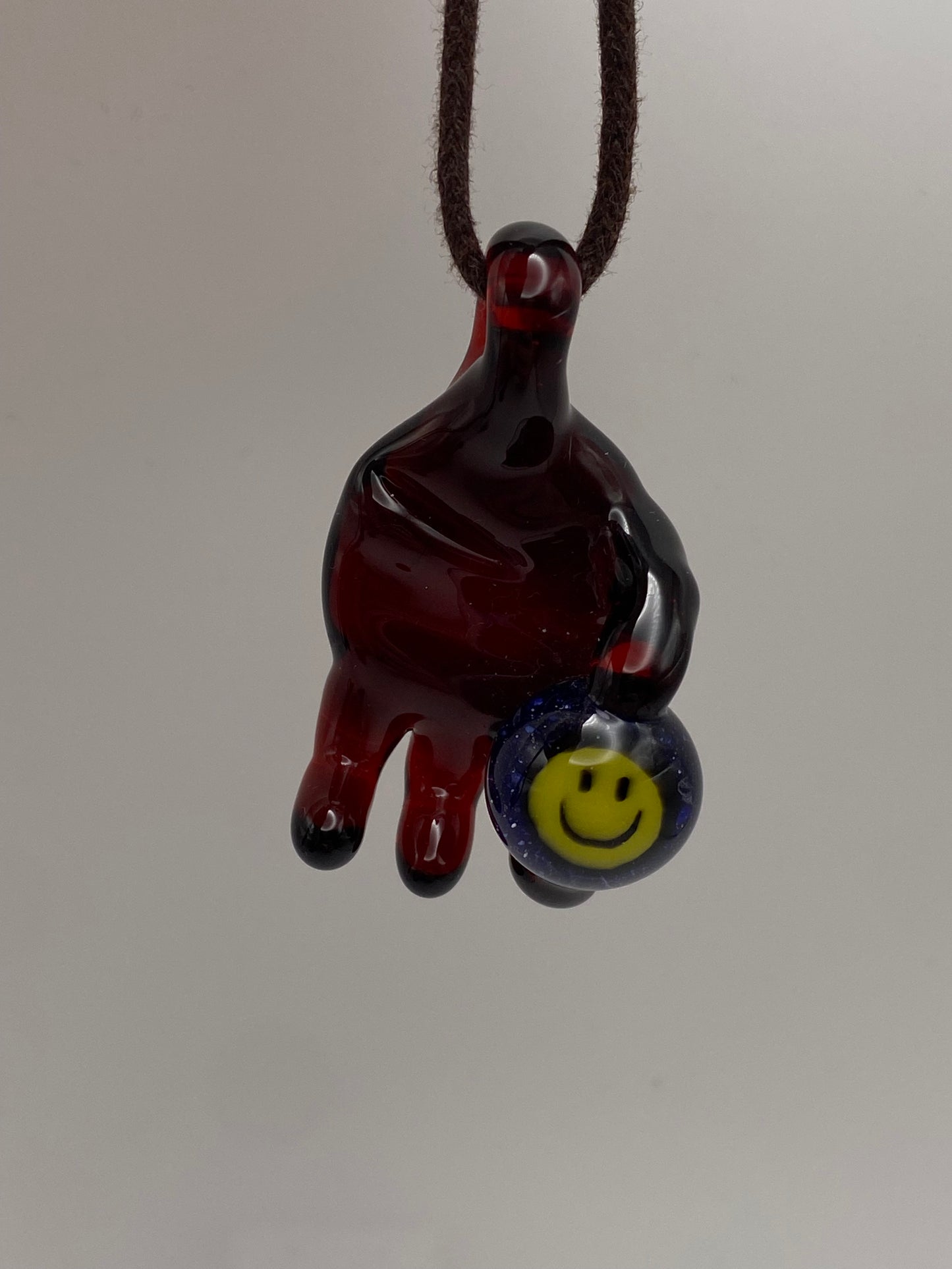Holding onto a Smile Pendant - Pomegranate
