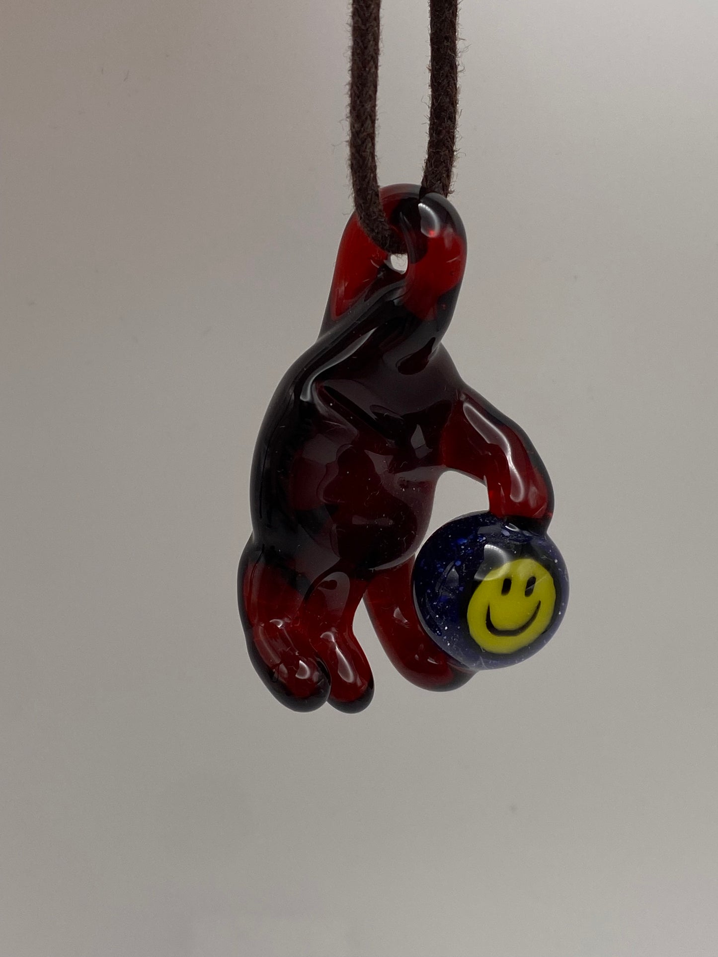 Holding onto a Smile Pendant - Pomegranate